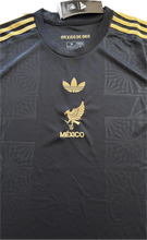 Load image into Gallery viewer, "Mexico 2025 Mexico de Oro Jersey Full Display - Adidas Originals Black & Gold Special Edition with Official El Tri Branding and Authentic Mexican National Team Design" chest