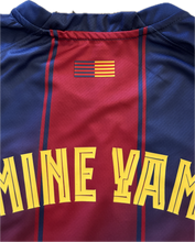 Load image into Gallery viewer, Blue and red sports jersey with yellow text and flag design Lamine Yamal neck view
