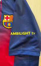 Load image into Gallery viewer, Blue sports jersey with FCB logo and 'Ambilight TV' text on a yellow Lamine Yamal #10 FC Barcelona Nike 2025-26 Home Jersey Front View - Champions League 5 Star Badge