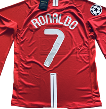 Load image into Gallery viewer, Cristiano Ronaldo Manchester United Long Sleeve Jersey Close-up Detail - Premium Nike Soccer Jersey Showing Official UEFA Champions League Patches, Manchester United Club Badge, and Authentic AIG Sponsorship Branding