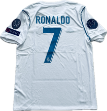 Load image into Gallery viewer, Real Madrid soccer jersey with Cristiano Ronaldo name and number 7 on the back, along with sponsor patches.