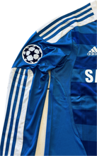 Load image into Gallery viewer, Side view of Chelsea Champions League jersey highlighting the sleeve details and overall silhouette