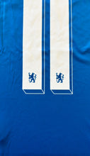 Load image into Gallery viewer, Chelsea jersey displayed on hanger showing the complete design and fit of the Munich Victory Edition