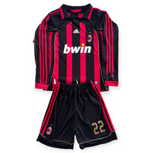 Load image into Gallery viewer, Black and red sports jersey with shorts on a white background