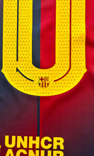 Load image into Gallery viewer, "Lamine Yamal Barcelona Jersey Close-Up Detail - Nike Dri-FIT Technology, Champions League 5 Star Badge, Official FC Barcelona Crest and Sponsor Logos"