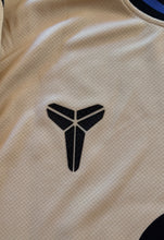 Load image into Gallery viewer, "Nike FC Barcelona x Kobe Mamba Yamal Jersey Detail Shot - Special Edition Beige Champions League Kit with Official Player Number 10 and Barcelona Branding" Kobe Logo