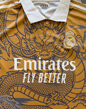 Load image into Gallery viewer, Real Madrid "Dragon" Men's Soccer Kit (Jersey + Shorts Set) - Gold dragon logo front
