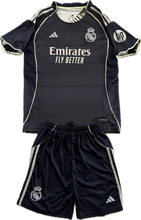Load image into Gallery viewer, Real Madrid 2025-26 Youth Away Kit (Jersey + Shorts) - Adidas Champions League showing the Adidas logo and Real Madrid logo embroidered with the emirates logo
