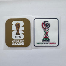 Load image into Gallery viewer, Two FIFA World Cup 2026 emblems on a white background: a gold-toned square sticker with the FIFA World Cup trophy graphic and text, and a white rectangular patch with the multicolor tournament logo and 'Mexico USA Canada' text.
