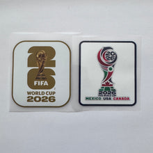 Load image into Gallery viewer, Two FIFA World Cup 2026 stickers on a white background, one with a gold and brown design and the other with a multicolor design featuring Mexico, USA, and Canada.
