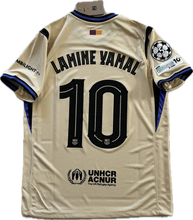 Load image into Gallery viewer, Beige sports jersey with &#39;Lamine Yamal 10&#39; printed on it, featuring UNHCR ACNUR logo. Back View Nike Barcelona
