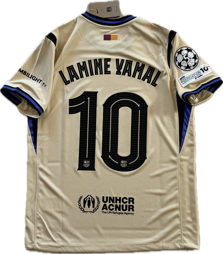 Beige sports jersey with 'Lamine Yamal 10' printed on it, featuring UNHCR ACNUR logo. Back View Nike Barcelona