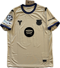 Load image into Gallery viewer, Beige sports jersey with various logos on a white background Nike Yamal Front View Kobe Jersey
