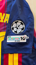 Load image into Gallery viewer,  &quot;Lamine Yamal #10 FC Barcelona Nike 2025-26 Home Jersey Front View - Champions League 5 Star Badge, Official Nike Swoosh, Authentic Barcelona Crest with Blaugrana Colors&quot;

