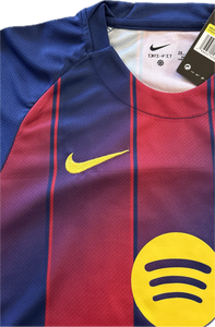 Close-up of a sports jersey with Nike and Spotify logos, featuring blue, red, and yellow colors. "FC Barcelona Youth Home Kit 2025-26 - Complete Yamal #10 Soccer Set"
