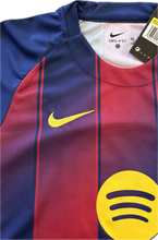 Load image into Gallery viewer, Close-up of a sports jersey with Nike and Spotify logos, featuring blue, red, and yellow colors. "FC Barcelona Youth Home Kit 2025-26 - Complete Yamal #10 Soccer Set"

