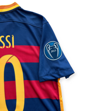 Load image into Gallery viewer, Close-up of the back of a blue FC Barcelona soccer jersey with red and yellow horizontal stripes, a yellow number 0, and a UEFA Champions League 2013 patch on the sleeve, set against a plain white background.

