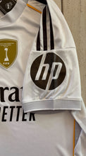 Load image into Gallery viewer, Real Madrid Mbappé Bellingham 2025-26 Adidas Home Jersey with Intercontinental &amp; 15x sleeve view with HP logo
